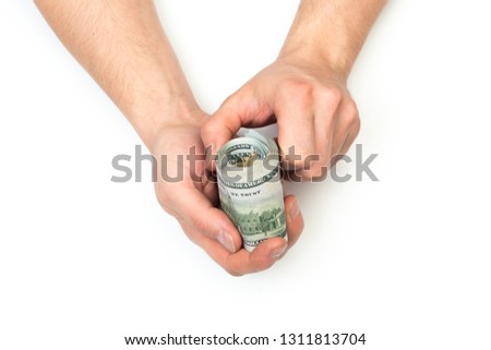 man holding rolled American dollars banknotes