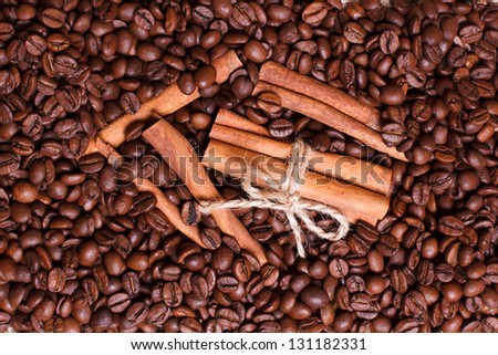 Background of coffee beans and cinnamon