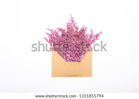 greeting card poster with lilac flowers in craft envelope isolated