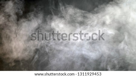 white smoke tails on dark background 