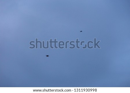 Group of drones in blue sky background