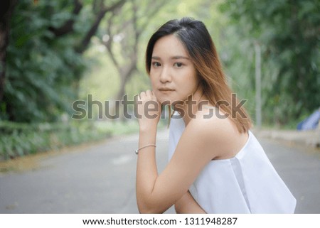 Portrait of thai adult beautiful girl relax and smile