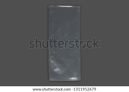 transparent cellophane bags on a gray background