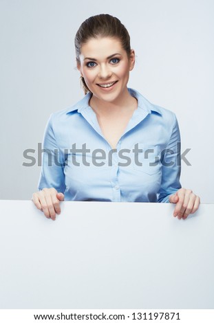 Business woman isolated portrait . Smiling woman show  big blank board . Close up female face portrait with arms on blank card. Emotion face .