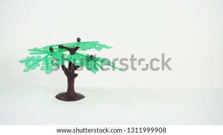                 Plastic tree toy isolated on white background - Image                