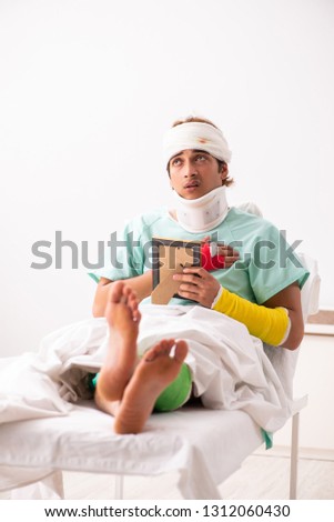Young injured man staying in the hospital