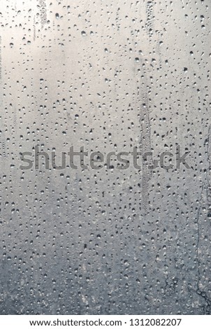 raindrops on glass in sunny weather