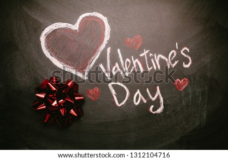 The inscription on the Valentine's day slate chalkboard