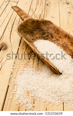 White rice on wooden kitchen table