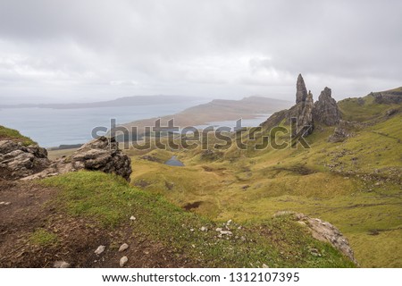 The fairytale landscape of the Trotternish peninsula on the Isle of Skye in the Highlands of Scotland, with the landslip stacks of the Old Man of Storr. 