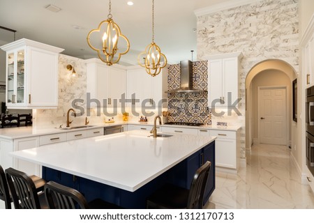 Beautiful luxury home kitchen with white cabinets. Royalty-Free Stock Photo #1312170713
