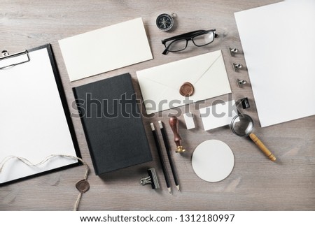 Photo of blank retro stationery on wooden background. Branding mock up. Flat lay.