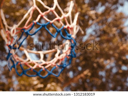 Isolated parts of a basketball nets unique blurry photo