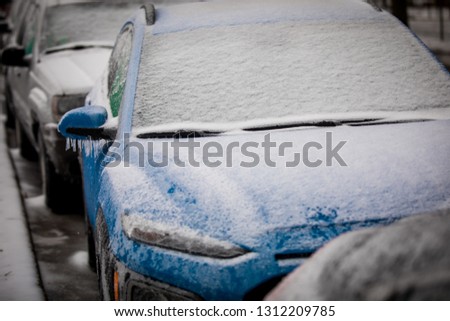 freezing rain ice coated car.  Frozen car. Bad driving weather in freezing rain.
