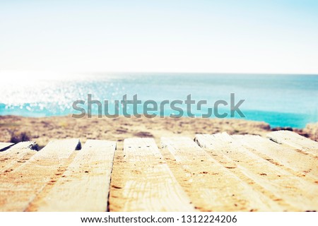 Blur beautiful nature tropical beach with bokeh sun light wave abstract background. summer vacation travel concept.