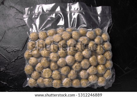 Prepack frozen falafel meatballs, vegetarian diet package blowing (bagginess) in vacuum packaged ready to cooking. Royalty-Free Stock Photo #1312246889
