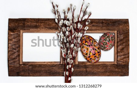 Easter Pussy-willow and Easter egg on wooden background. Happy Easter card. with Happy Easter