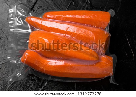 Prepack Vegetables Ingredients. Fresh raw sweet juicy carrots, peeled, ready to cooking package blowing (bagginess) in vacuum packaged. Royalty-Free Stock Photo #1312272278
