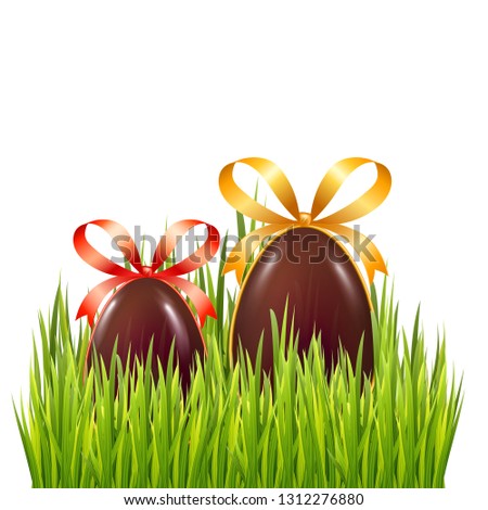 Chocolate Easter eggs in green grass isolated on white background. Decoration elements for holiday web banner design. 