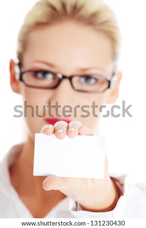 Beautiful blond businesswoman with businesscard