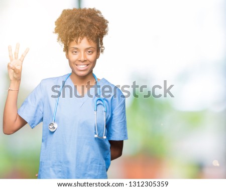 Young african american doctor woman over isolated background showing and pointing up with fingers number three while smiling confident and happy.