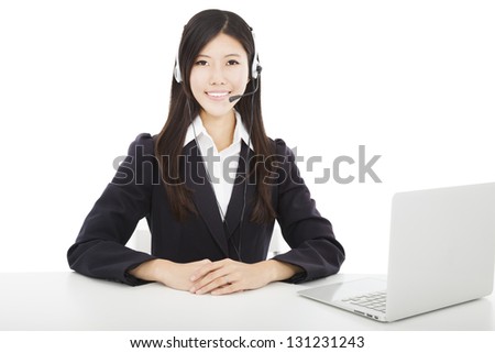 Young  smiling businesswoman with headset and laptop