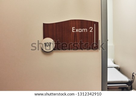 Wood door signs in medical office building. 