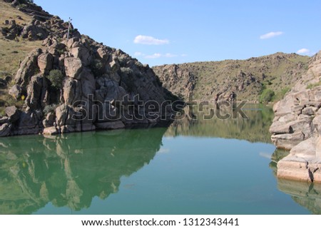 green pond in nature, reflection effect in the hills of light in water.