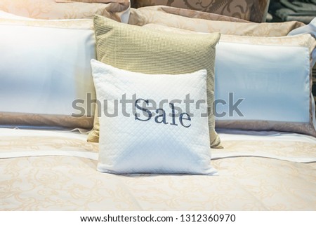 SALE - inscription on the pillow in the store of linen and furniture during the sale