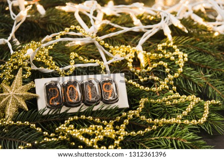 2019 garland with Christmas decoration on natural fir tree, selective focus
