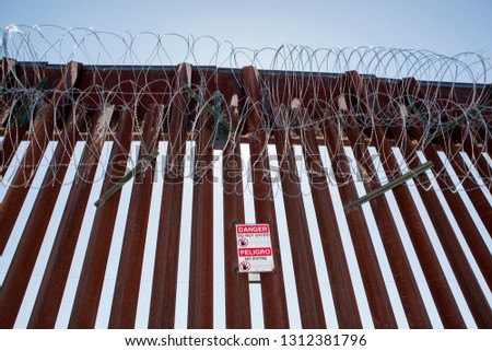Concertina Wire on the border fence at the Doulas Arizona Port of Entry with Agua Prieta Mexico / Raul Hector Castro Port of Entry