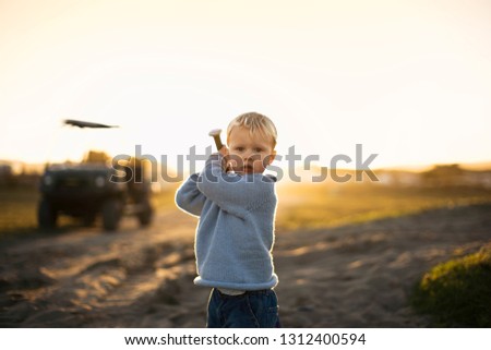 Little boy playing baseball