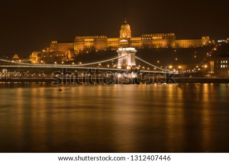 View of Budapest at a misty night from Danube bank.