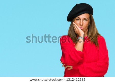 Middle age adult woman wearing fashion beret over isolated background thinking looking tired and bored with depression problems with crossed arms.