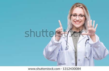 Young blonde doctor woman over isolated background showing and pointing up with fingers number seven while smiling confident and happy.