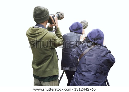 Professional wildlife photographer on white background ,Photographer takes a picture with professional camera, Nature photographer