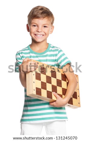 Happy boy with chessboard isolated on white background
