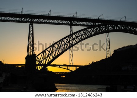 Silhouette of the Dom Luis I Bridge before dawn, Porto - Portugal.