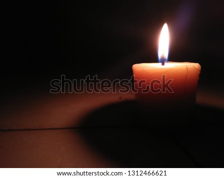 beautiful candle photo in the dark