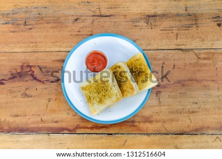 breakfast garlic bread plate on wood stock photo 