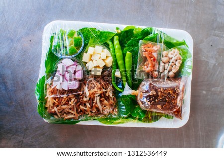 Mieng kham is a traditional snack from Thailand and Laos. The name "miang kham" translates to "one bite wrap", from miang (food wrapped in leaves) and kham (a bite). 