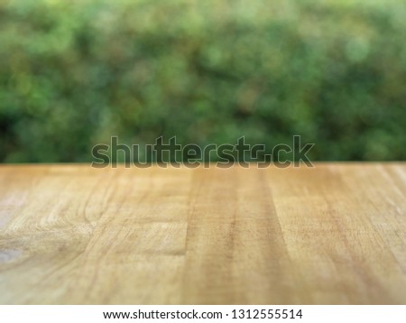 Wood table with the free space nature background