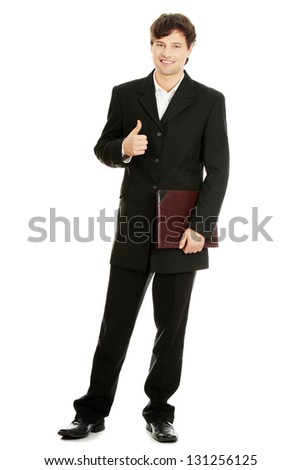 Portrait of young handsome businessman, gesturing OK