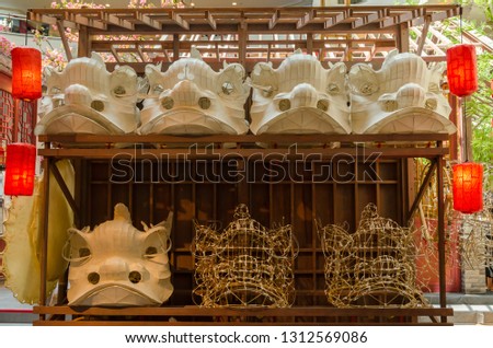 Traditional chinese lion dance head mold display on the shelves. 