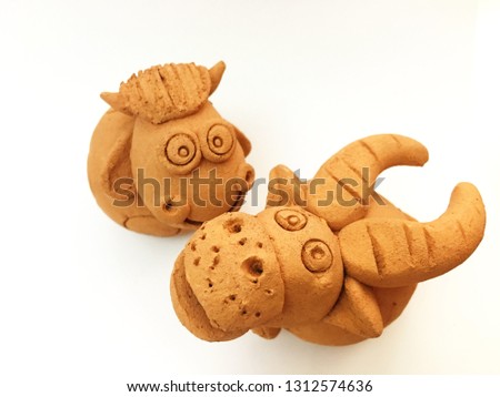 Cute Buffalo and cow clay doll on white background