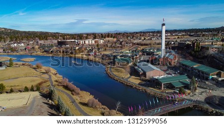 Aerial drone photo of the old mill on the Deschutes River in Bend, Oregon. Royalty-Free Stock Photo #1312599056