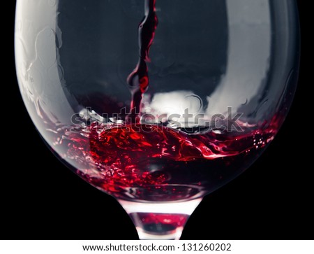 Red wine on a black background ,saved clipping path. Royalty-Free Stock Photo #131260202