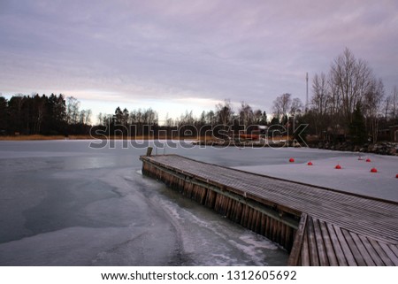 Scenic view of frozen bay near Pyharanta, Finland