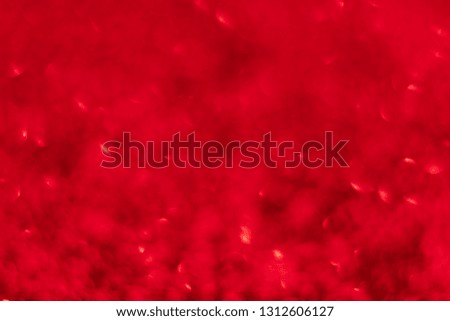 Red glitter festive background with bokeh lights. Celebration concept for