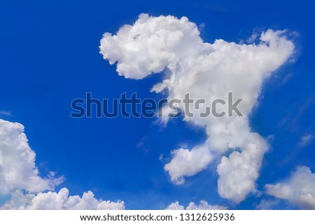 Animal cloud, Fresh blue sky with floated white soft and fluffy cloudy shown shaping like a dinosaur name Tyrannosaurus Rex was walking, Background for kid education or imagination learning for Child.